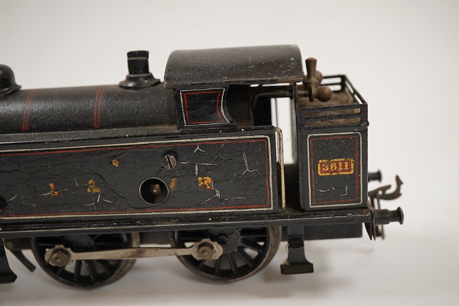 An 0 gauge Bing for Bassett-Lowke tinplate clockwork LNWR 4-4-0T locomotive, 3611, with original clockwork mechanism